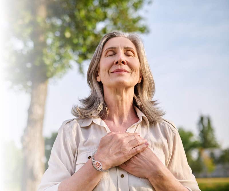 Women wearing Medicalert ID and feeling peacefull