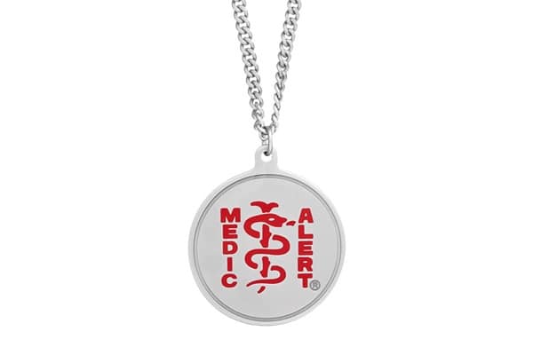 Round silver necklace on a silver chain with a red MedicAlert logo.